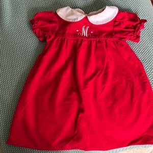 Red corduroy monogrammed with “M”